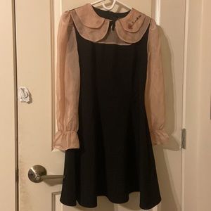 Little black dress with sheer puffy sleeves